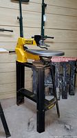 Full view of scroll saw mounted on stand