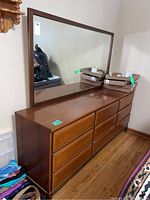 Full view of dresser with attached mirror from left angle