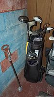 Full view of golf bag with clubs and hunting seat