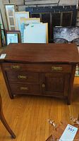 Full view of the wooden server showing 3 drawers and small cabinet on the right side, brass hardware, wood grain and finish.