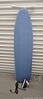Front view of ironing board and iron on floor with cover visible