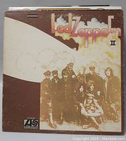 Led Zeppelin II vinyl record album cover showing band in sepia tones with zeppelin airship