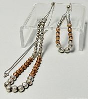 Necklace and bracelet displayed to show design and bead pattern.