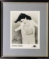 Framed signed photo of Shania Twain showing full frame and matting.