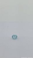 Aquamarine gemstone shown from a slight angle to highlight clarity and cut.