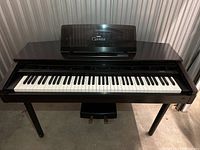 Full view of Yamaha Clavinova CVP-7 digital keyboard showing wooden body, keys, and music stand.