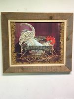 Full view of the framed cloth rooster picture showcasing the rustic wooden frame and straw border.