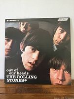 Front cover of the vinyl record showing black and white band portrait with album title and artist name.
