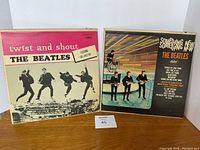 Photo of two Beatles vinyl albums: Twist and Shout and Something New, showing front covers.