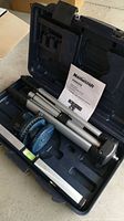Full kit inside hard carrying case including tripod, laser level, and manual