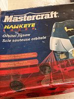 Box label showing Mastercraft Hawkeye Orbital Jigsaw branding and features including integrated laser line with on/off switch and variable speed from 800-3000 SPM.
