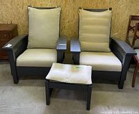 Front view of both armchairs side by side with ottoman in front
