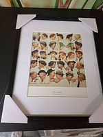 Full view of the framed print, showing the black frame and white matting with the artwork inside.