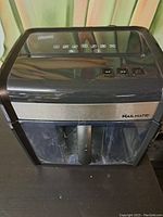 Front of MailMate paper shredder showing control buttons and logo.