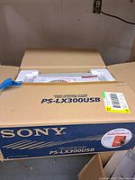 Closed box of Sony PS-LX300USB stereo turntable system showing product branding and packaging condition.