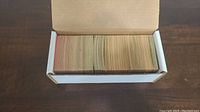 White box filled with over 400 vintage non-sports cards arranged upright showing age-related discoloration and wear.