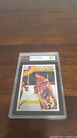 Graded 1978-79 Topps Ken Dryden hockey card in protective casing showing front image of Ken Dryden in Team Canada goalie uniform.