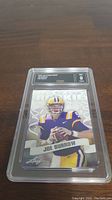 Front of Joe Burrow rookie card graded Gem Mint 9, showing the player in LSU jersey and the card's front design.