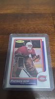 Front side of the Patrick Roy rookie reprint hockey card showing player image and name.