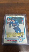 Topps rookie hockey card of Peter Stastny in Nordiques uniform, showing front side in plastic protective holder.