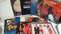 Photo showing a collection of classic rock vinyl records with covers featuring various artists and albums, arranged to show diversity of the lot.