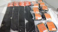 Lot contents showing four long braided hair pieces and multiple short curly hair pieces with Golden Brand tags, all in plastic packaging.
