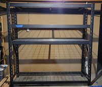 Front view of full shelving unit showing four wire grid shelves in black frame