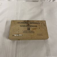 Closed box labeled 'Economic Minerals Saskatchewan' with mention of the Department of Mineral Resources and the Saskatchewan Geological Survey.