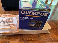 Box of Olympus C-5050 Zoom digital camera with packaging and instruction manual