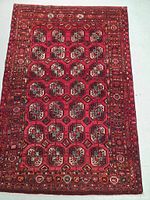Full top-down view of red panel design rug
