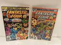 Photo shows two Marvel Comics Fantastic Four comic books, issues 176 and 177, side by side in protective covers.