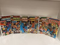 Front view of seven Fantastic Four comic books from Marvel Comics, clearly showing covers with characters and issue numbers.