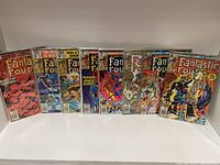 Front view showing set of 10 Fantastic Four comic book issues from Marvel Comics, displayed upright in protective sleeves.