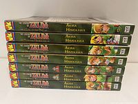 Side view of the set showing all 7 volumes with titles and author Akira Himekawa on spine