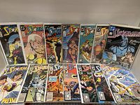 View of 17 Starman comic books issues 7 to 25 showing front covers arranged upright on a flat surface.
