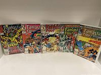 Front view of five Fantastic Four comic books from the 330s issue range, standing side by side.