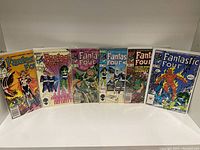 Photo showing the full set of six Fantastic Four comic books from 1985-1986, standing upright side by side.