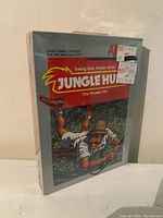 Front view of sealed Atari 2600 Jungle Hunt game cartridge with original Zellers price tag and plastic wrap