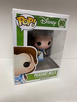 Front view of the boxed Disney POP! collectible showing Peasant Belle figure inside, clearly labeled as #90 in the series.