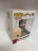 Front and side view of the Funko POP! box showing Zapp Brannigan figure inside, box is unopened and in good condition with visible branding and character illustration.