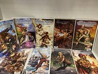Lot of 9 Adventurers of Sinbad 1001 Arabian Nights comic books laid out on a flat surface showing detailed cover art.