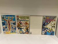 Front covers of four Fantastic Four comic books issues 371, 372, 374, and 376 in plastic sleeves.