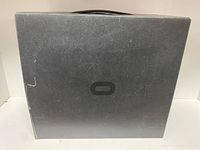 Closed black box with Oculus logo on top, original packaging for Oculus Rift 2 headset.