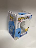 Photo showing the front and left side of the unopened Funko POP! Pokémon Squirtle figure box with visible branding and figure number 504.