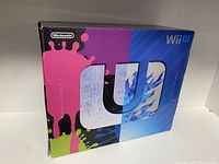 Front of retail box showing Wii U logo with colorful ink splat design