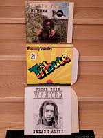 Front covers of three vinyl LP records: Legalize It by Peter Tosh, Tribute by Bunny Wailer, and Wanted: Dread & Alive by Peter Tosh showing artwork and titles