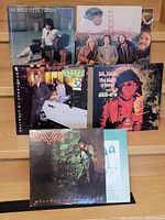 Front view of six vinyl album covers showing artists, titles, and sleeve artwork.