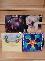 Photo showing four vinyl LP records: Johnny Winter - Live Johnny Winter And, Blondie - Blondie, Foghat - Fool For The City, Steppenwolf - At Your Birthday Party.