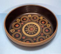 Top-down view of the Denby Arabesque bowl showing the detailed circular floral pattern in the interior base.