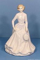 Front view of Royal Doulton figurine showing full figure and facial details.